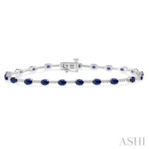 1/3 Ctw Round Cut Diamond & 4x3MM Oval Cut Sapphire Precious Bracelet in 10K White Gold