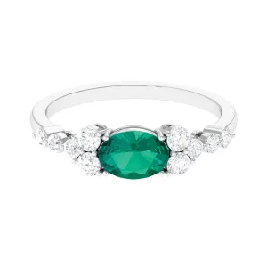 Emerald Solitaire East West Ring with Diamond Side Stones